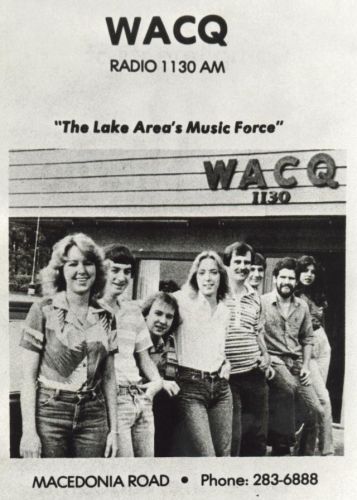 WACQ Radio 1130 AM promo with four people standing outside the station, “The Lake Area’s Music Force” tagline