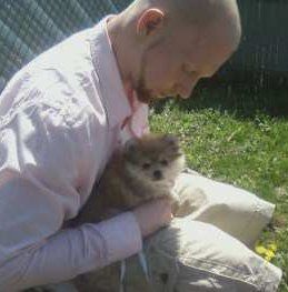 Pomeranian with teenager