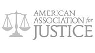 American Association for Justice The logo for the american association for justice has a scale of justice on it.