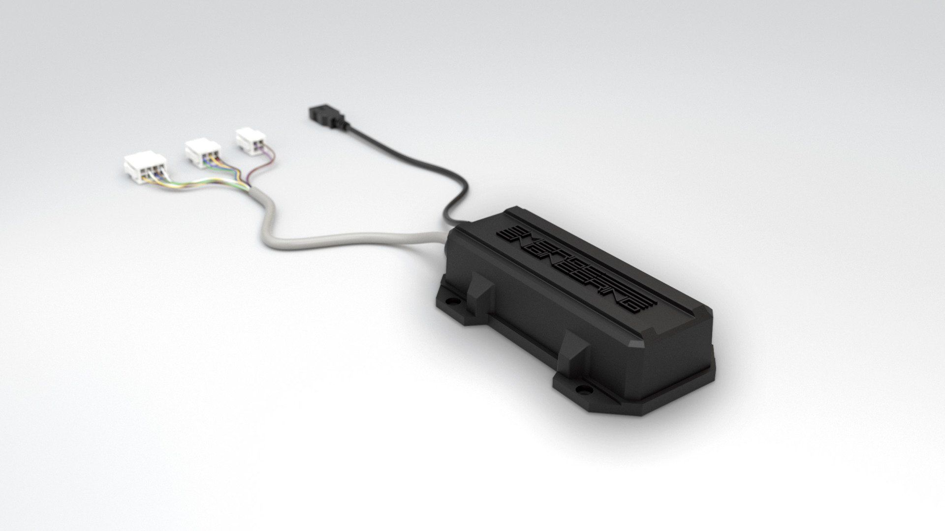 A black device with three wires attached to it is sitting on a white surface.
