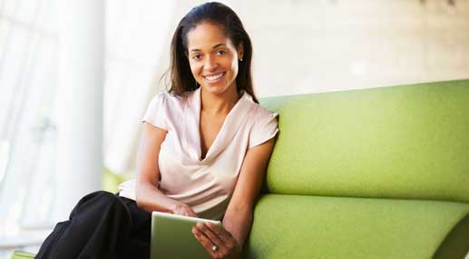 woman sitting on green chair