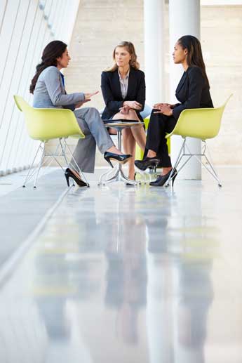 women discussing business