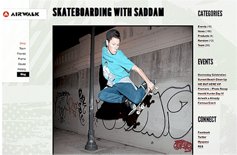 A skateboarder is jumping in the air while riding a skateboard