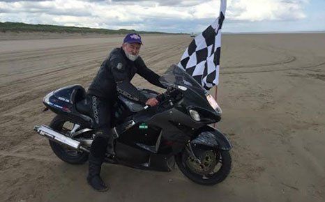 a man posing on the motorbike