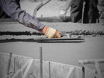 Construction Woker Leveling Pavement — Rock and Stone in Taos, NM
