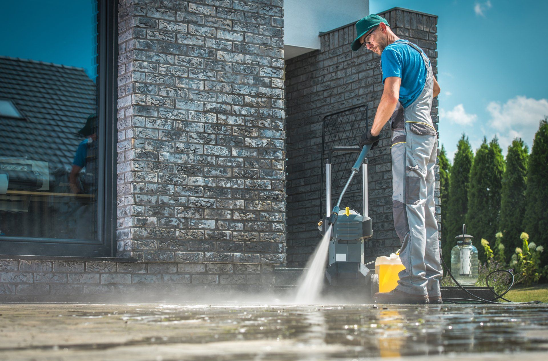 Pressure Washer Cleaning in Front of the House.