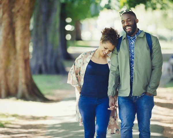 Young couple walking in a park