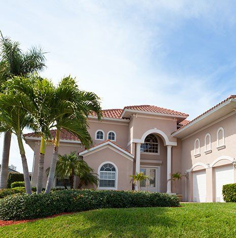 Palm Tree Removal Company — Beautiful House with Trees in Las Vegas, NV Palm Tree Removal Company — Beautiful House with Trees in Las Vegas, NV