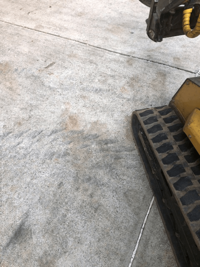 Rubber marks where the skid steer just made a turn