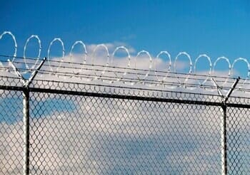 Security fence with barbed and razor wire — Fences in Pasadena, TX Security fence with barbed and razor wire — Fences in Pasadena, TX