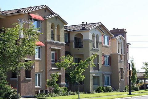 A row of multi-story apartments.