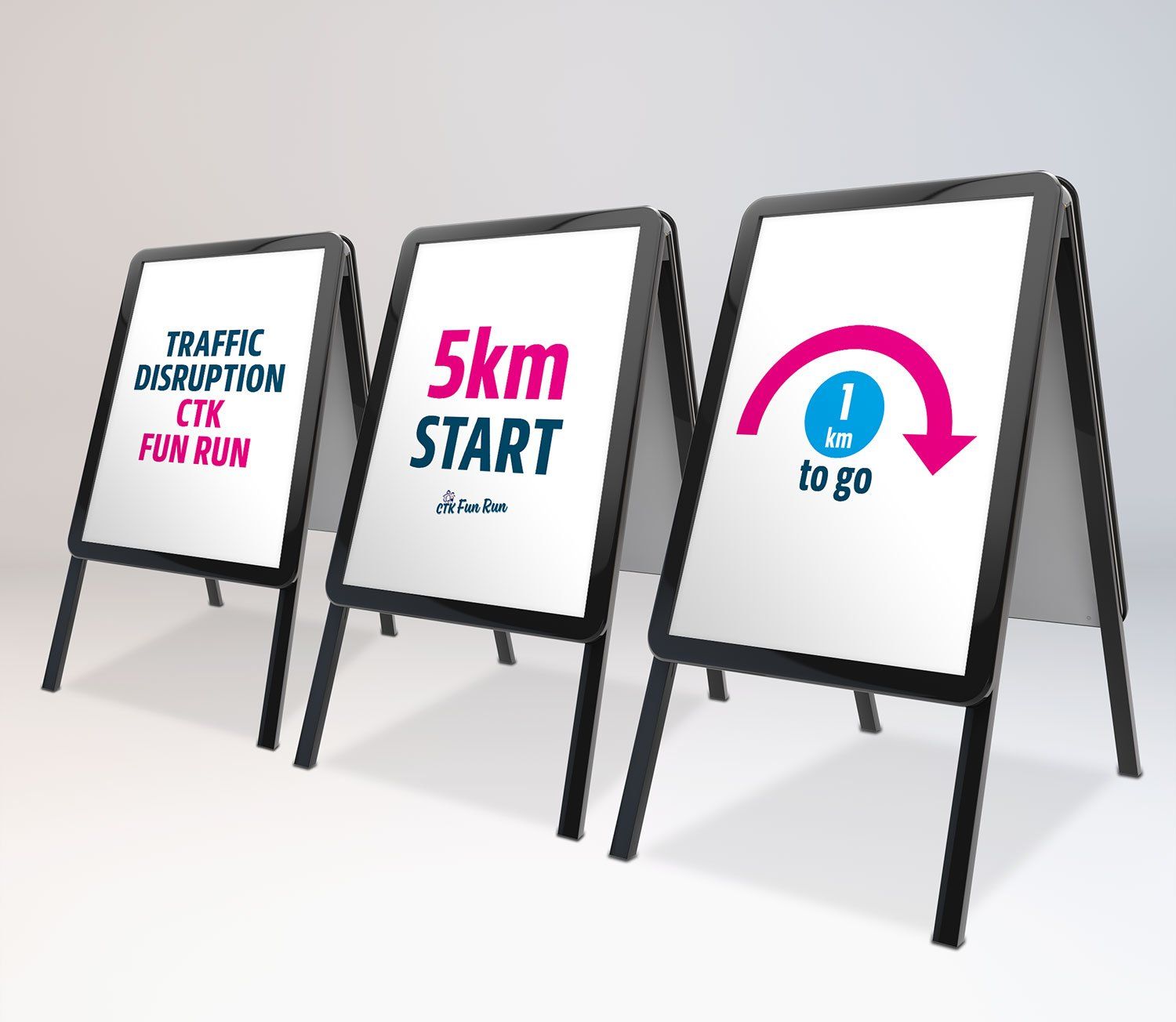 Three a frames with signs on them one of which says 5km start