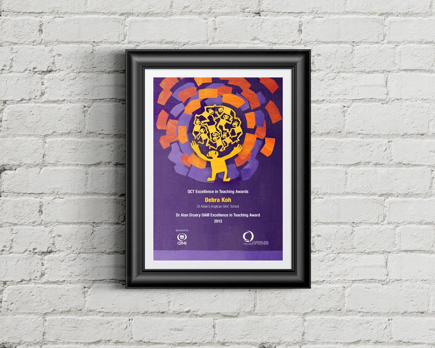 A framed purple and orange poster on a white brick wall