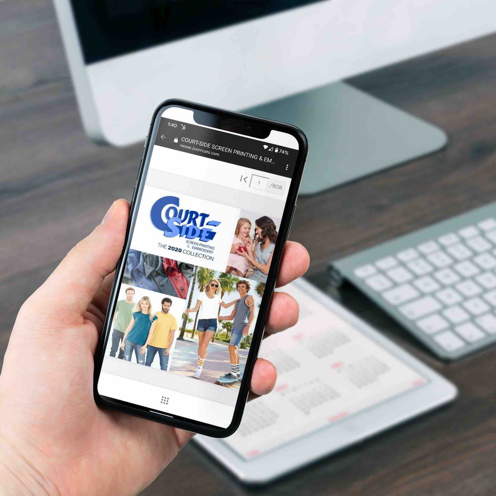 A hand holds a smartphone displaying a 