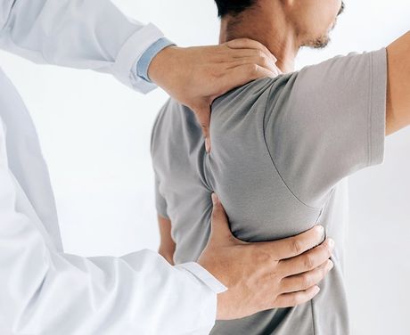 Treatment On Man's Back — Opelika, AL — Meals Chiropractic Clinic Treatment On Man's Back — Opelika, AL — Meals Chiropractic Clinic