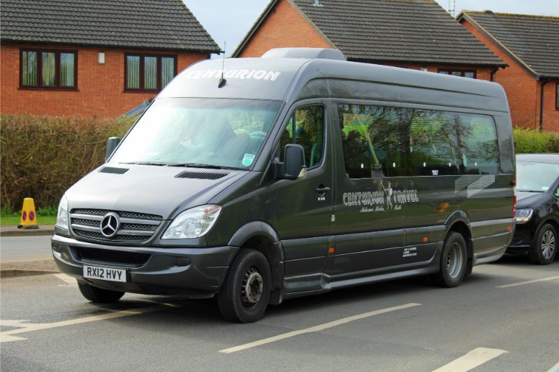 A mercedes van is parked on the side of the road