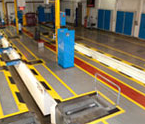 A large room with a lot of yellow lines on the floor.