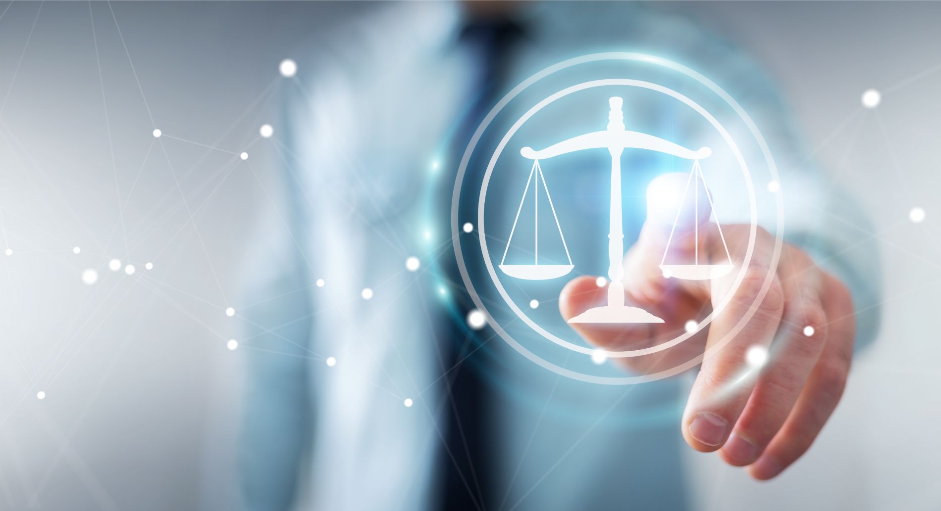 Man touching a glowing scales of justice icon, symbolizing law and order.