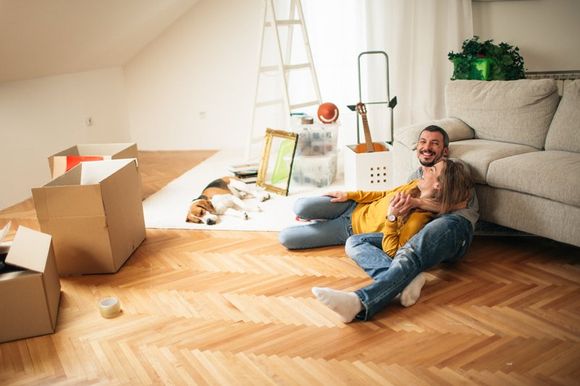 A couple happy to be moving into their new home