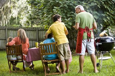 A family has a backyard barbecue