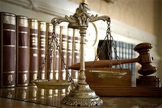 Scale of Justice with Gavel Behind - We Care in Corona, CA