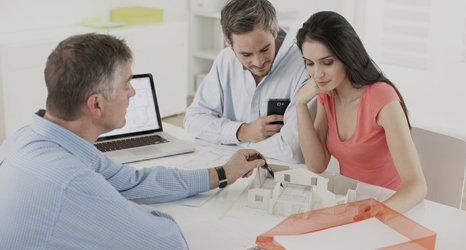 a couple looking at structural designs