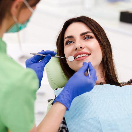 Smiling Girl on a Dental Chair — Margate, FL — Crescent Dental Smiling Girl on a Dental Chair — Margate, FL — Crescent Dental