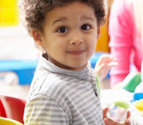 little kid with big black eyes watching at you