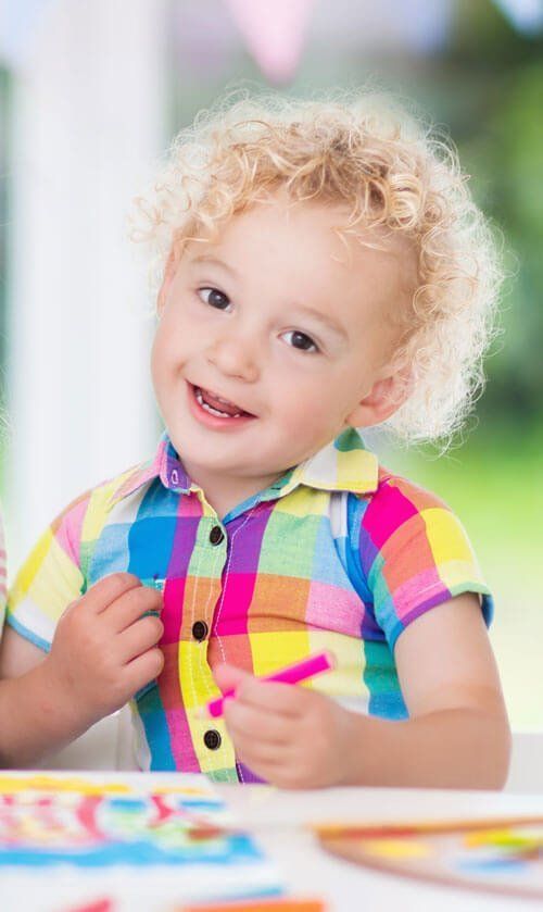 smiling little blonde boy