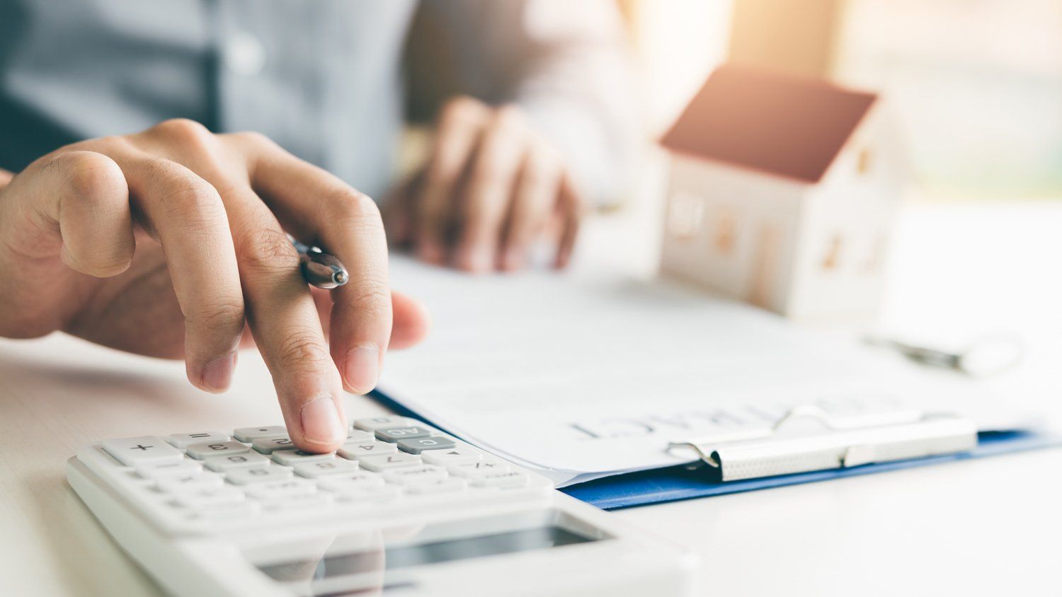 Man Computing Loan — Texas — Central Finance