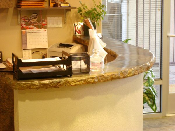 A counter in a room with a calendar on the wall