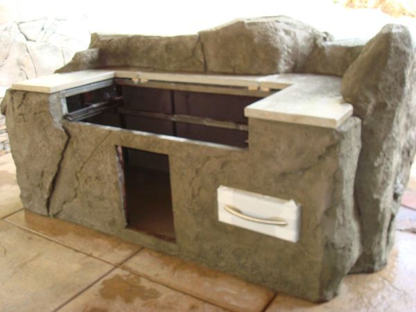 A large rock with a drawer underneath it