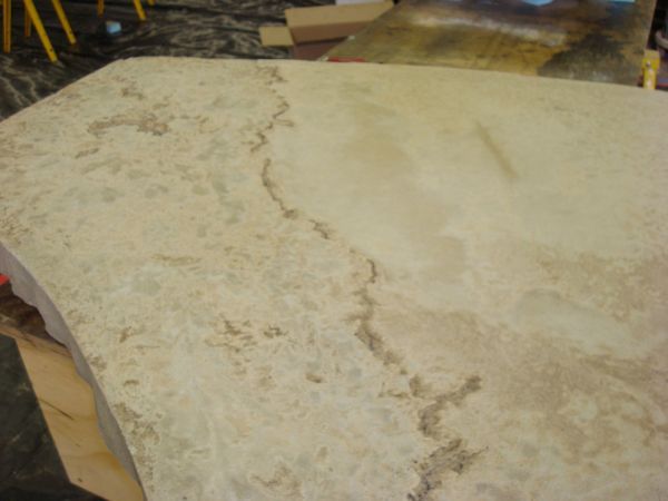 A large piece of marble is sitting on a table.