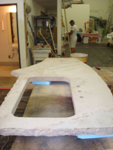A large piece of stone with a hole in the middle of it