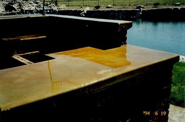A photo taken in 1994 shows a concrete counter top in front of a body of water