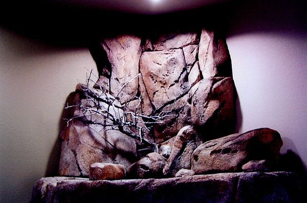 A statue of a person with thorns around their waist