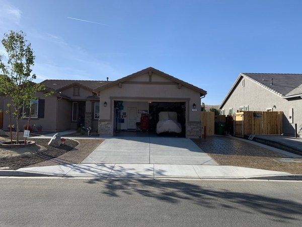 A house with a car parked in the garage
