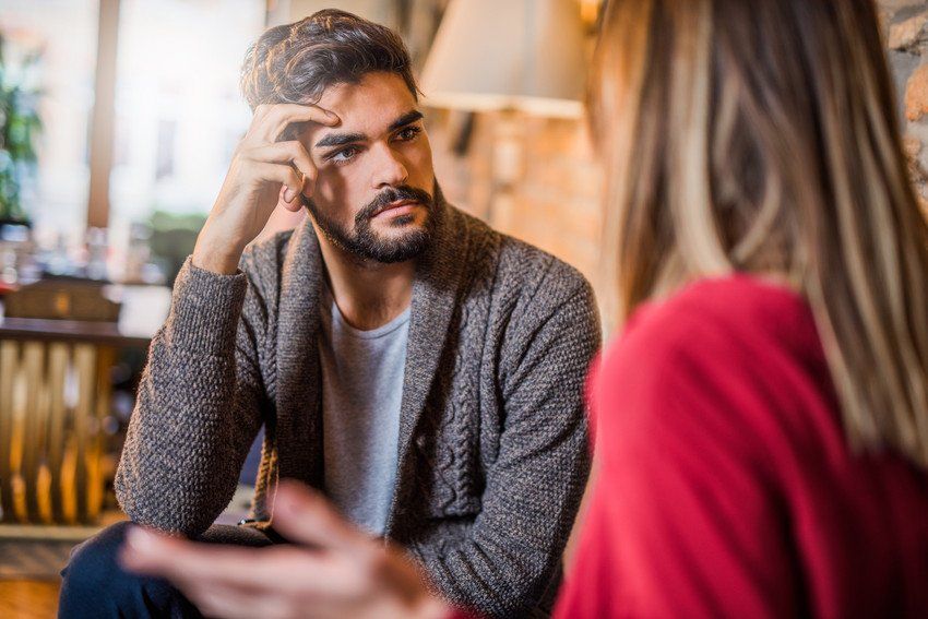 Concerned man with female partner