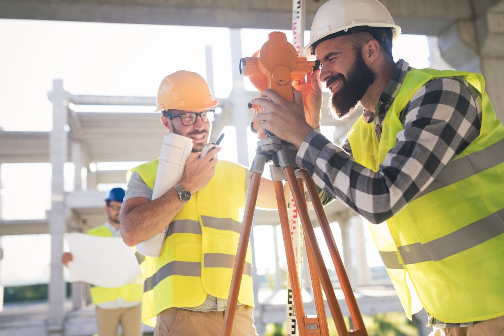 Commercial Surveying Services — Engineers On Construction Site Using Theolite In Johnson City, TN Commercial Surveying Services — Engineers On Construction Site Using Theolite In Johnson City, TN