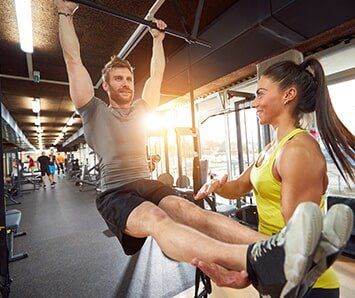 Trainer Helping Man Preparing for Knee Surgery — Training in Columbia, SC