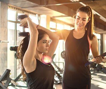 Trainer Helping Woman to Gain Her Strength Back — Training in Columbia, SC