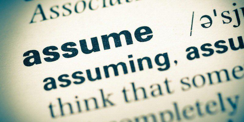 Dictionary page showing the word “assume” in bold blue-green print.