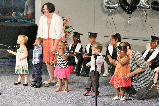 Student and Teacher celebrating graduation in Chesapeake, VA