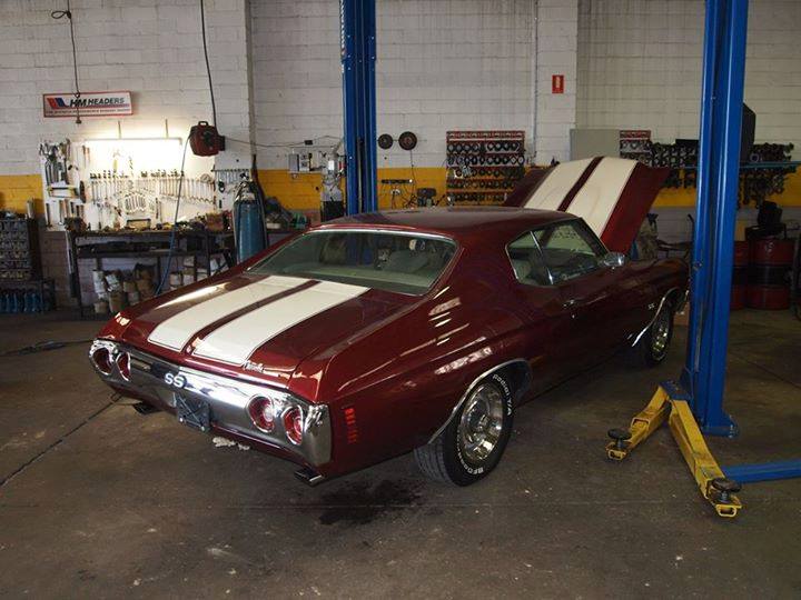 red car with white racing stripes