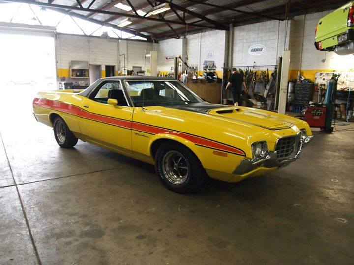 yellow car with orange stripes on sides