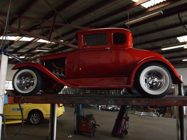 classic red car on lift