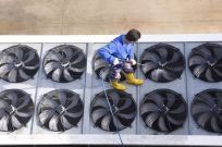 man cleaning air vents provided by a cleaning service companies in Wagga Wagga
