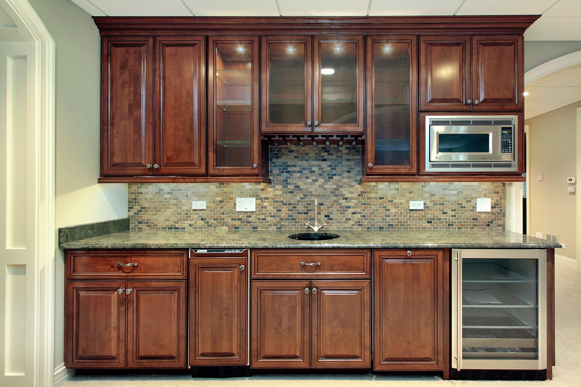 A custom basement bar/kitchen combo is a great enhancement to any basement!