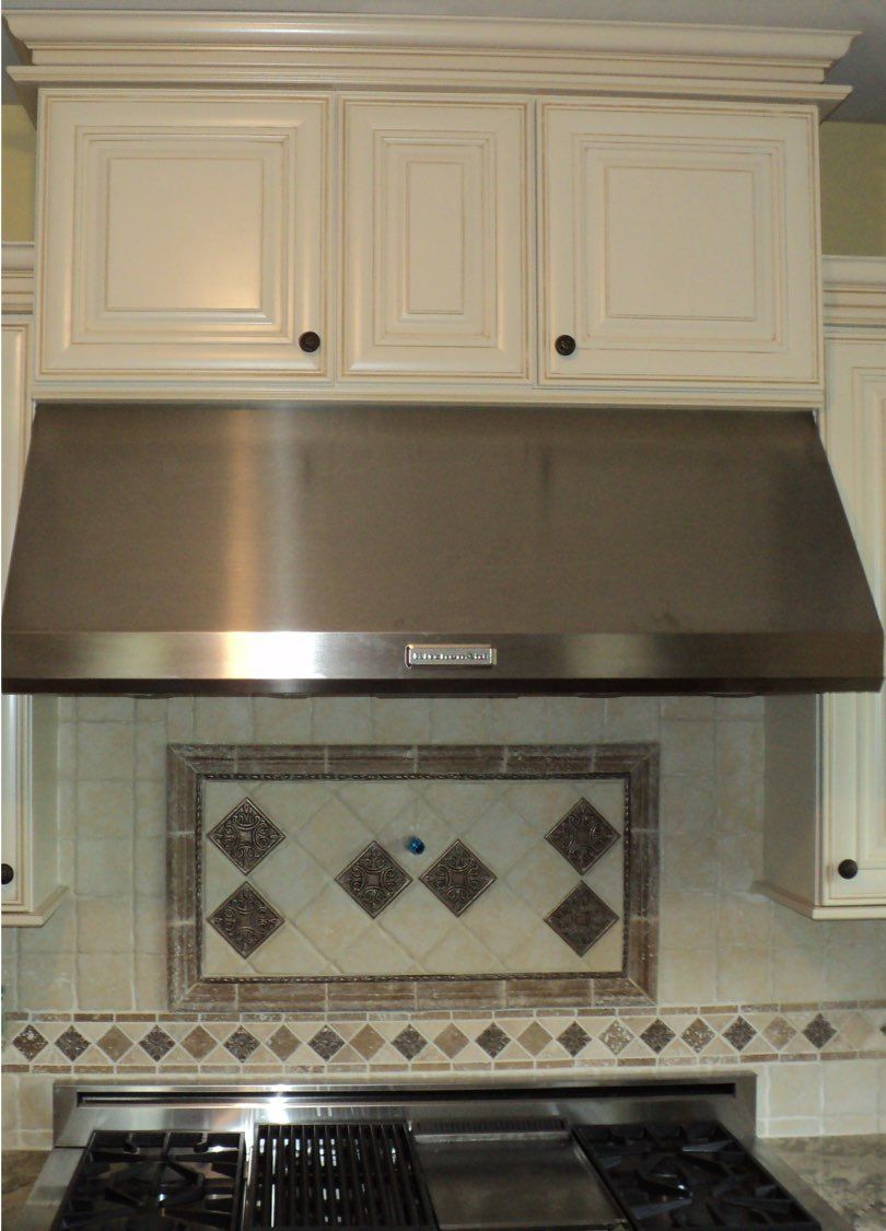 Custom inlaid tile backsplash