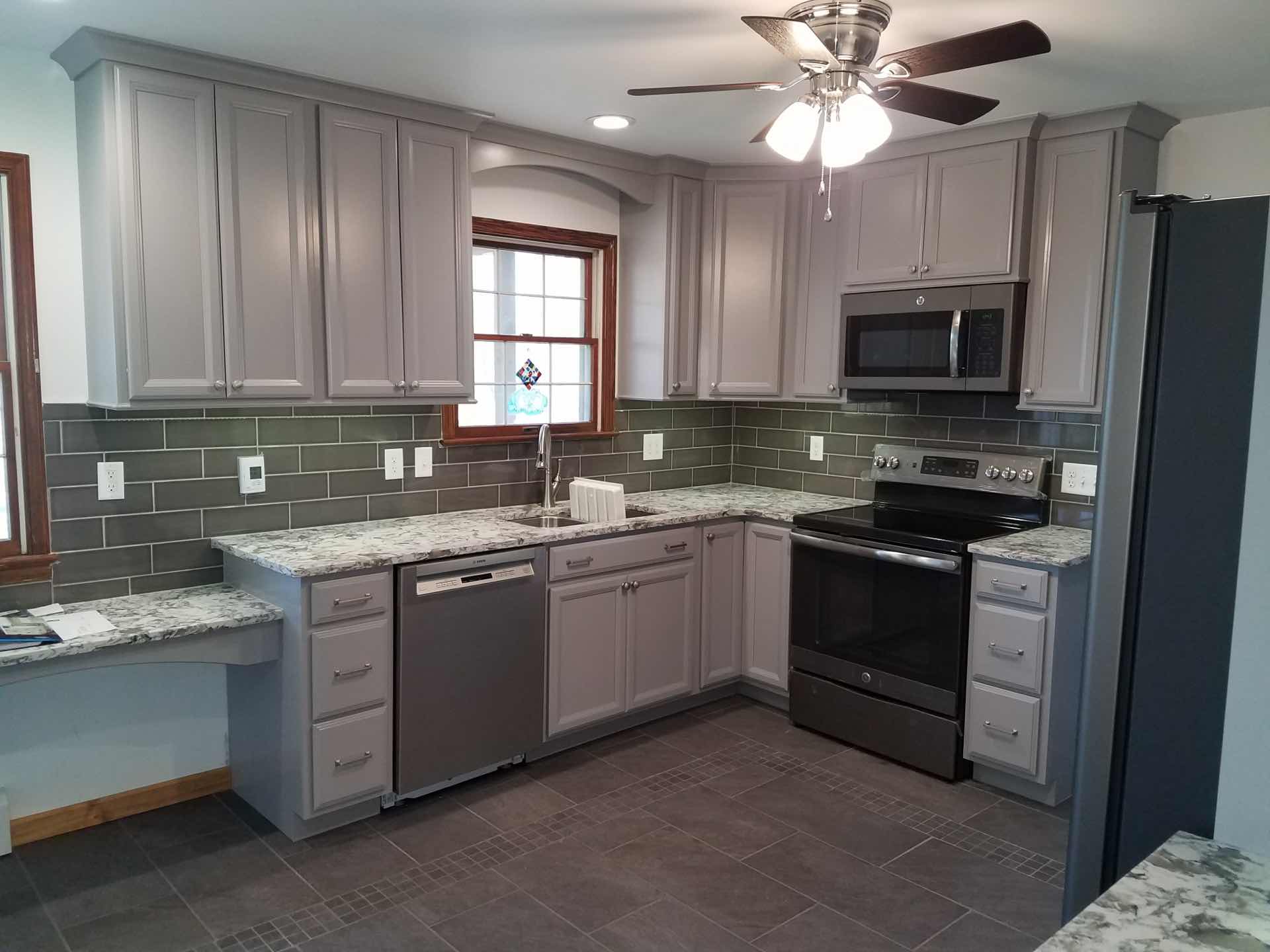 Gray tones are popular for kitchen cabinets and walls